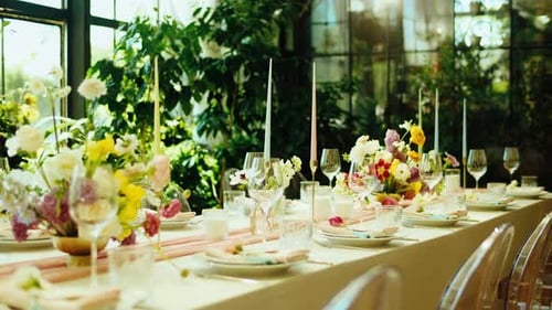 Decorated Wedding Reception Table Setting with Flowers