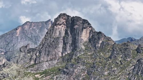 Majestic Ergaki Natural Park Mountains Standing Tall Under Cloudy Sky