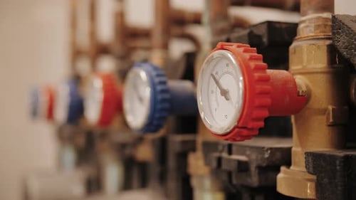 Gauges and Meters Connected to Pipes, Close Up