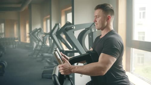 Process of Exercising on Plate Loaded Seated Row Machine By Middleaged Athlete