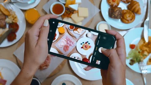 Woman Influencer and a Blogger Records Her Restaurant Breakfast