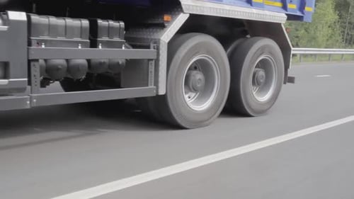 Truck Tires Driving Along Highway During Daytime