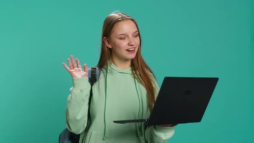 Woman Video Chatting on Laptop in Studio