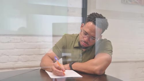 Adult Working at Desk in Office