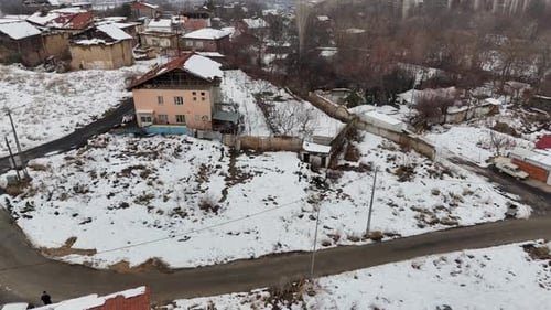 Snow Covered Land Plots and Detached Houses – Aerial Winter Drone View