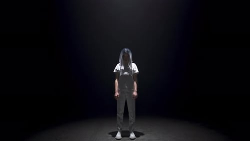 Stylish Woman Posing in Dark Studio