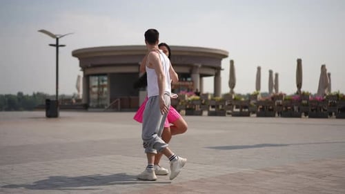 Slow Motion Outdoor Street Dance Training A Young Couple Practices a Street Dance on a Sunny Summer