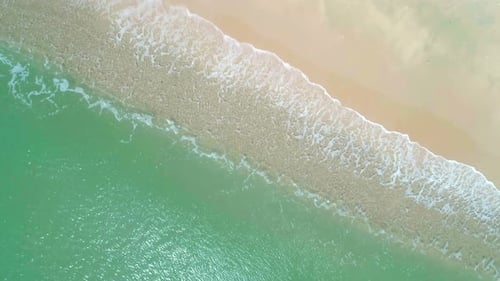 Aerial View of Sandy Beach and Turquoise Ocean Top View of Ocean Waves Reaching Shore on Sunny Day