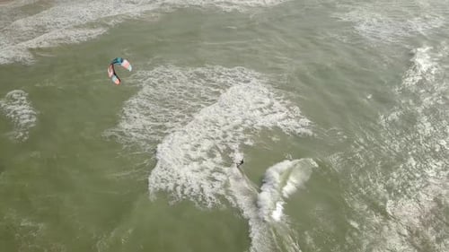 Aerial view of Kite surfer riding the smooth water of The Mediterranean Sea