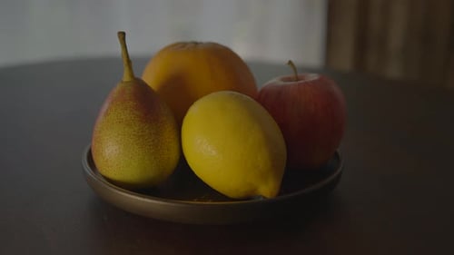 Bowl of Fruit on Dark Wooden Table