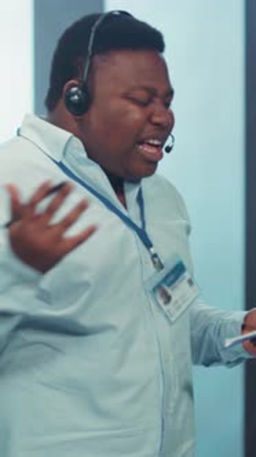 Frustrated Man Wearing Headset in Data Center