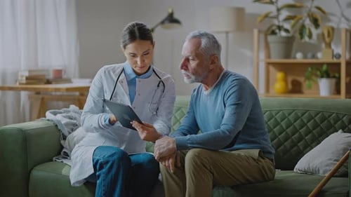 Doctor Discussing Medical Information with Senior Man