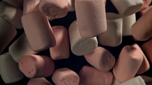 Pink and White Marshmallows Fly Up and Fall Down Filmed on a Highspeed Camera at 1000 Fps