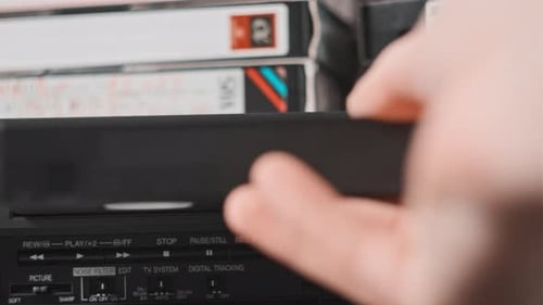 Insert VHS Cassette Into VCR Player