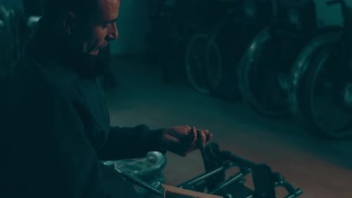 A Disabled Man Assembles a Stroller