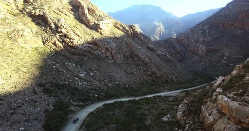 Aerial view, car drive on highway in countryside or travel on journey outdoor for summer tourism
