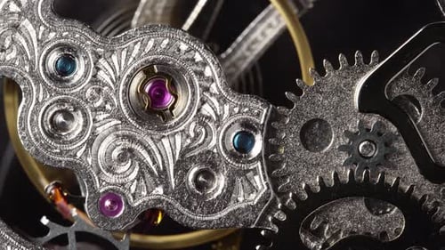 Antique Pocket Watch's Internal Gears and Moving Springs on Gray