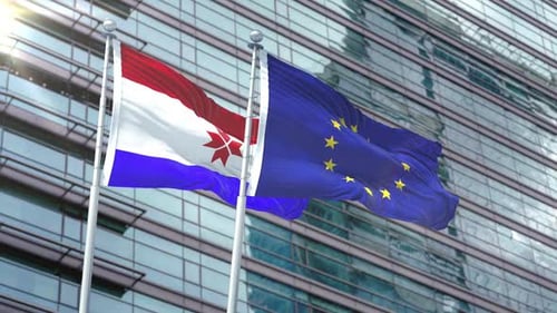 European Union and Mari El Flags Waving on Building Background