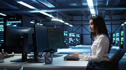 Portrait of Smiling Engineer Overseeing Data Center