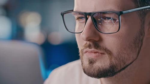 Close Up Shot of Man Eyeglasses Reflection Showing Stock Market Graphic Confident Business Analytic