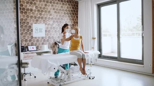 Woman Receives Physical Therapy in Clean Medical Office