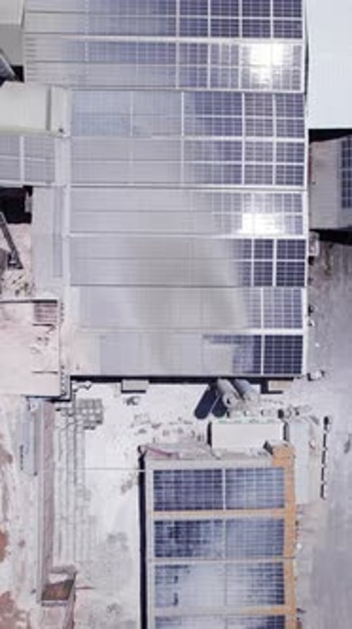 Industrial Building with Solar Panels on Rooftop