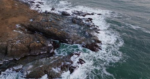 Waves Crashing On The Rocky Shoreline