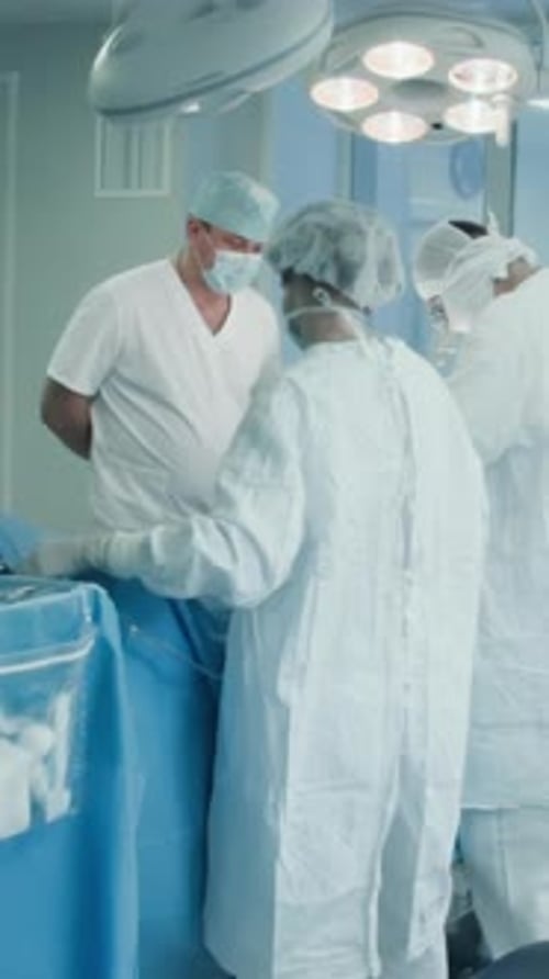 Surgical Team Operates Patient in Clinic
