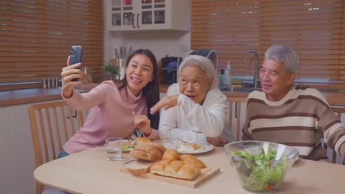 Family Poses for Selfie in Kitchen
