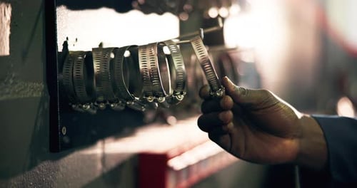 Hose clamps, mechanic and person in garage, hand and equipment for maintenance, repair and tools