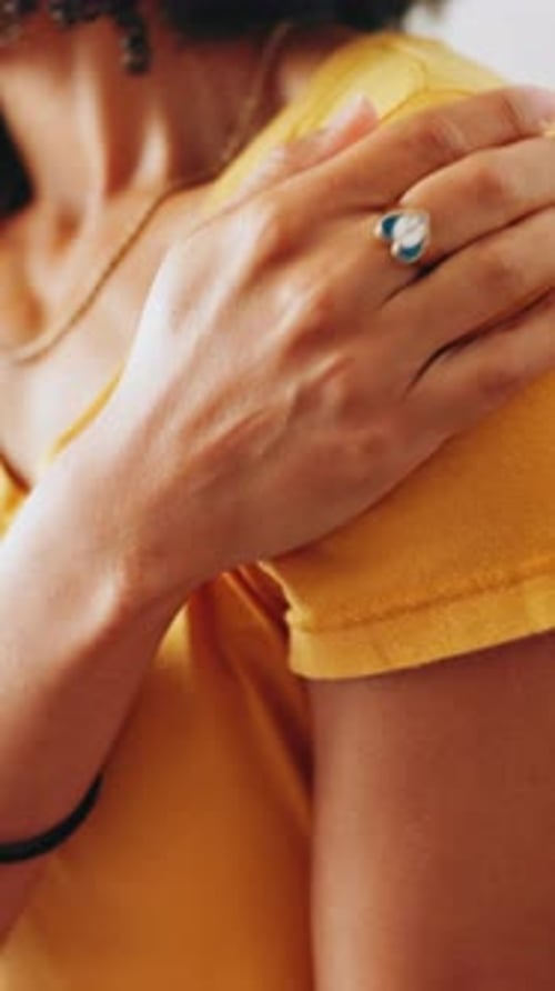 Woman Rubbing Shoulder for Pain Relief Close Up