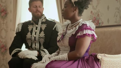 Elegant Man and Woman in Historical Clothing Converse