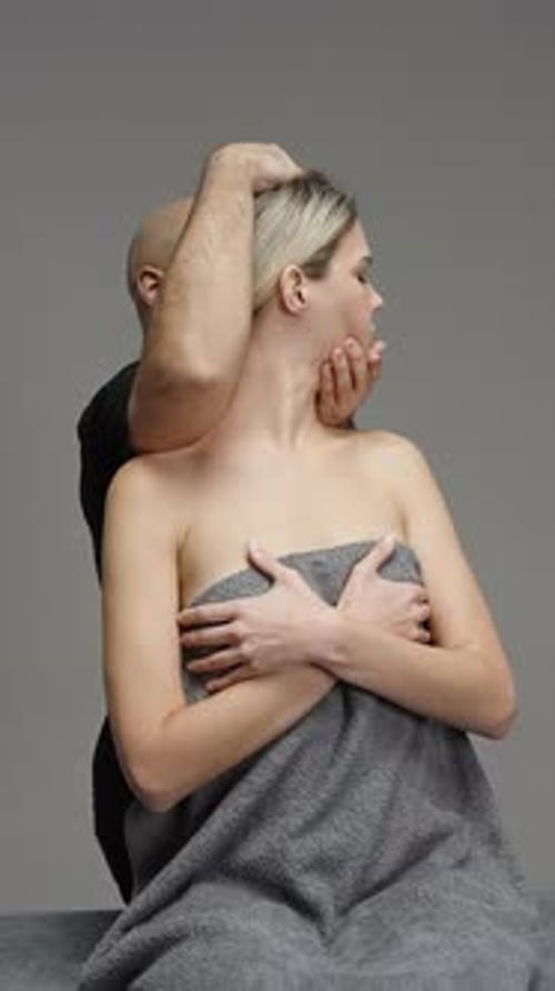 Woman Receives Neck and Shoulder Massage in Studio