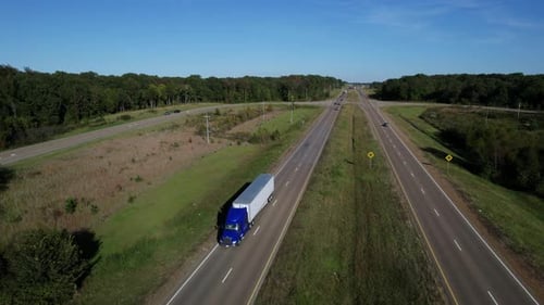 Aerial of Semi Truck Driving Down Highway in United States