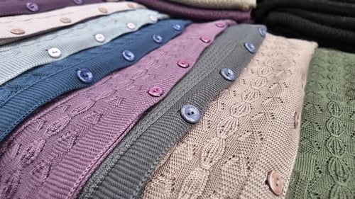 Colorful Knitwear Collection Displayed in a Market Setting
