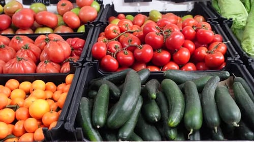 Various types of fruits and vegetables for sale at a market