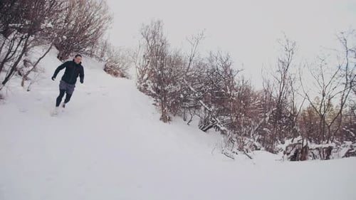 Of Male Runner Trail Running in Winter