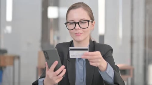 Woman Completes Online Payment with Credit Card