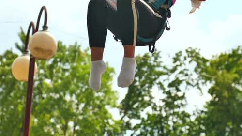 Teenage Girl Silhouette Jumping on the Trampoline Bungee Jumping