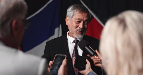 Man, press and mic for interview with talk, media questions for state official