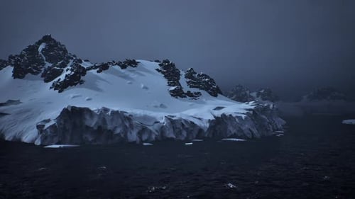 Gloomy Icy Labyrinth Surrounded By Turbulent Ocean and Drifting Ice Fragments