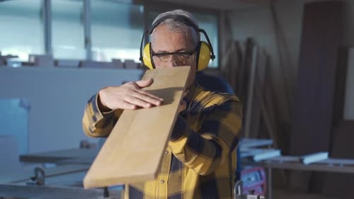 Carpenters working in a carpentry workshop.
