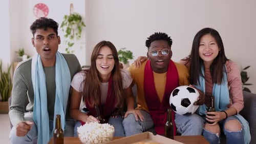 Multi Ethnic Young Football Fans People Supporting Their National Team on TV