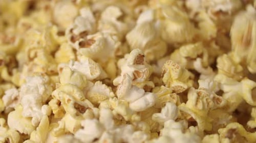 Mixing Hot Popcorn in Heap. Close Up of Fresh Popcorn Flakes. Popping
