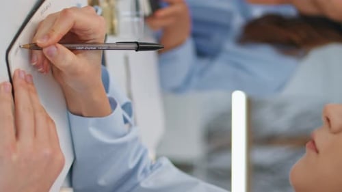 Closeup Hands Writing Notebook in Office Woman Planning Project Vertical View