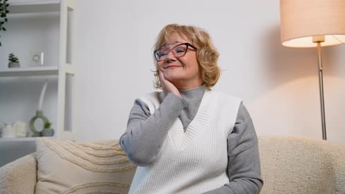 Blonde Woman Smiling Indoors On Couch