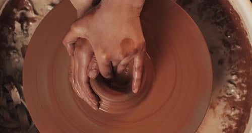 Potter Makes Pottery From Clay Close Up Making Ceramic Products From Red Clay Twisted Potter's Wheel
