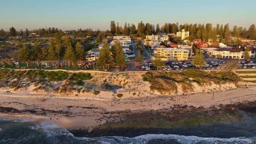 Aerial of Cottesloe Beach and suburb with apartments at sunset, Perth, Western Australia