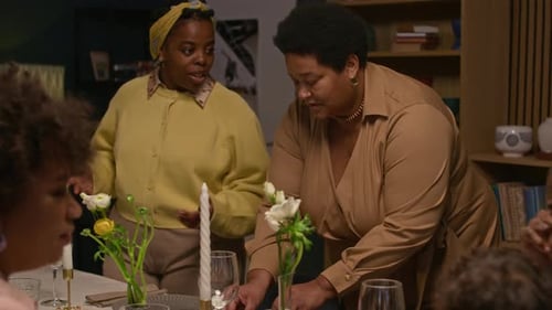 Family Gathering Around Table in Home