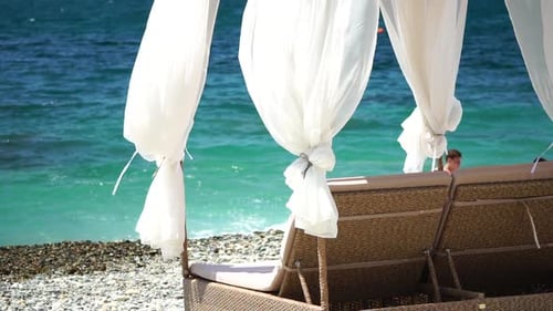 Bungalows Sea Beach Lounge Bed with White Silky Curtains Lounge Bed with Canopy at Seaside Beach